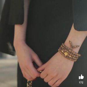 Agarwood Bracelet 108 beads With Gold Flower Charm